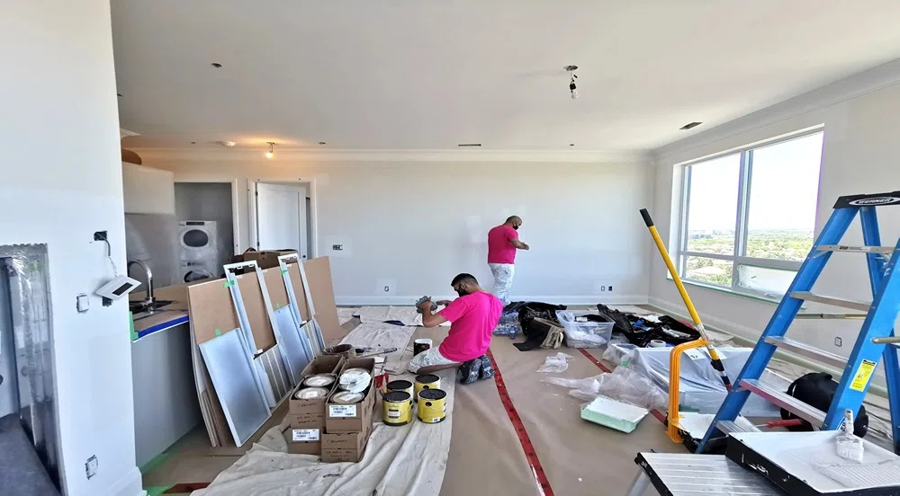 Paint Estimating integrates architectural plans, color palettes, and material costing within an Australian construction setting under warm daylight.